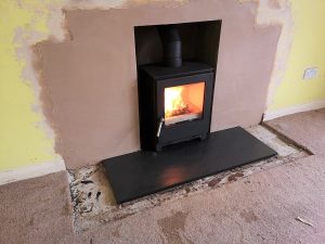 Fireplace enlargement and stove installation near Yeovil, Somerset.