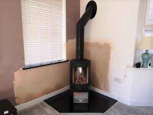 Freestanding stove with a twin wall chimney system in Taunton.