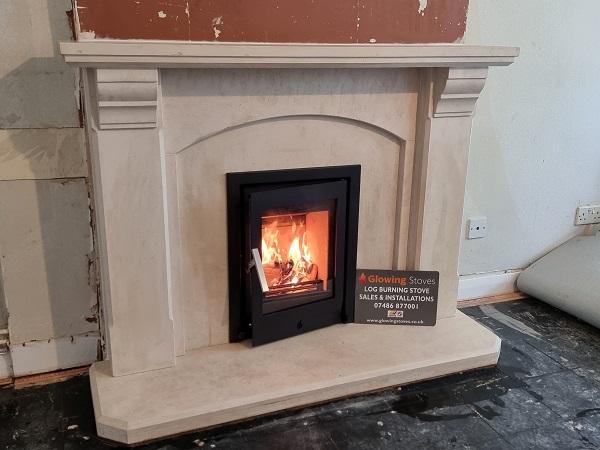 Limestone fireplace with an inset stove installation in Creech Saint Michael, Taunton.